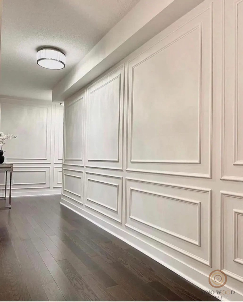 White wall panelling and mouldings