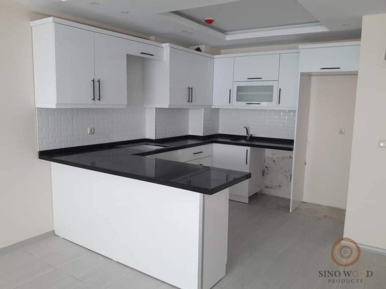 L-Shape White Kitchen with Dark Accents