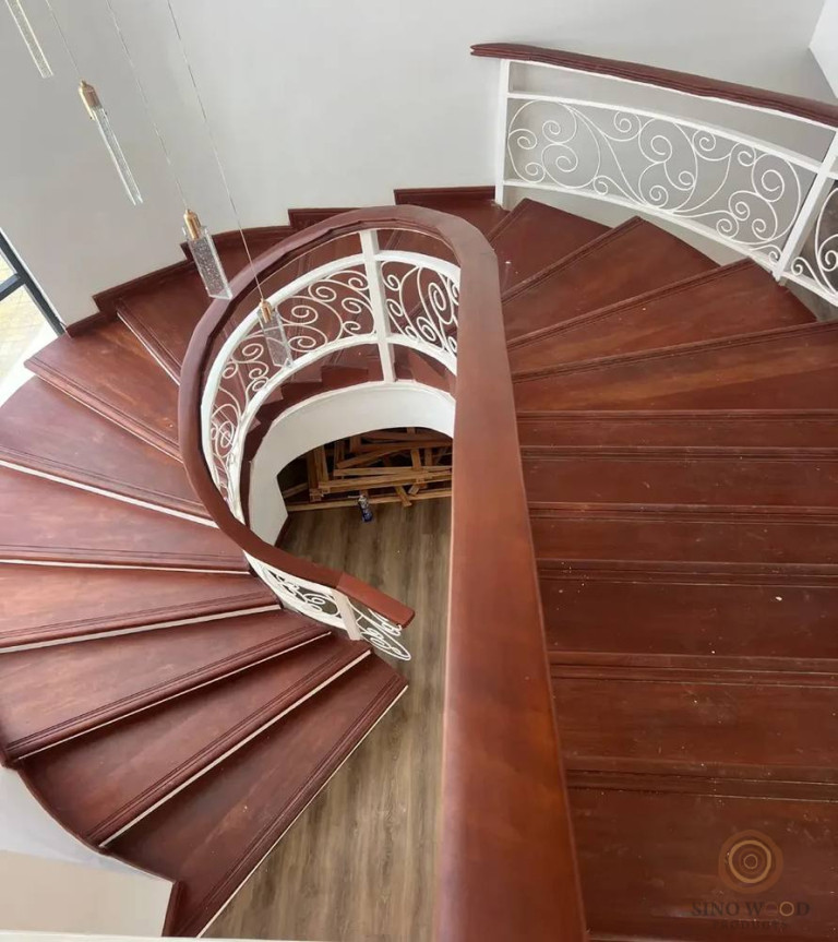 Curved Staircase with Wrought-Iron Balustrade