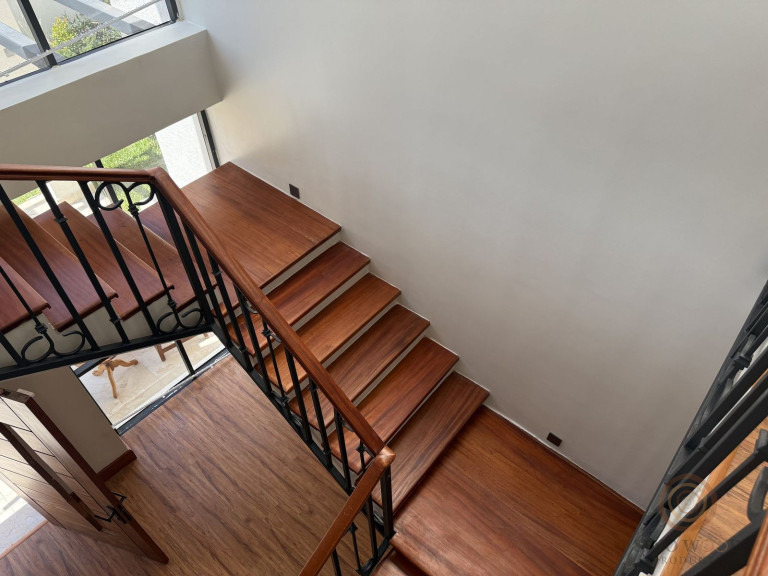 Mahogany Staircase with Wrought-Iron Balustrade